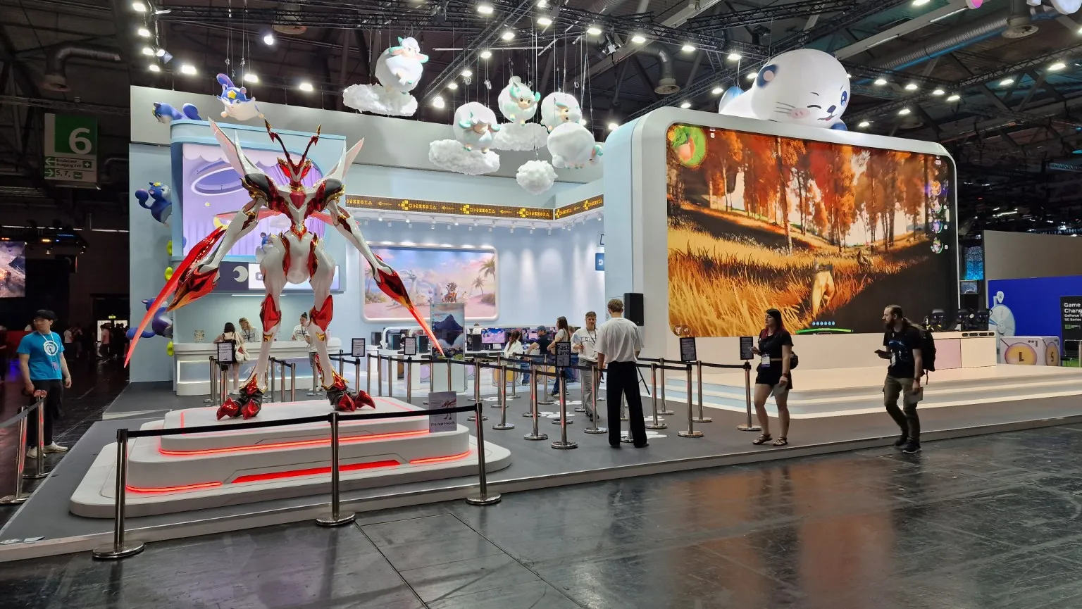 The Aniimo booth at gamescom 2026 with a large figure and play stations.